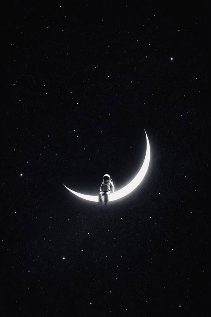 Astronaut on a crescent moon wallpaper