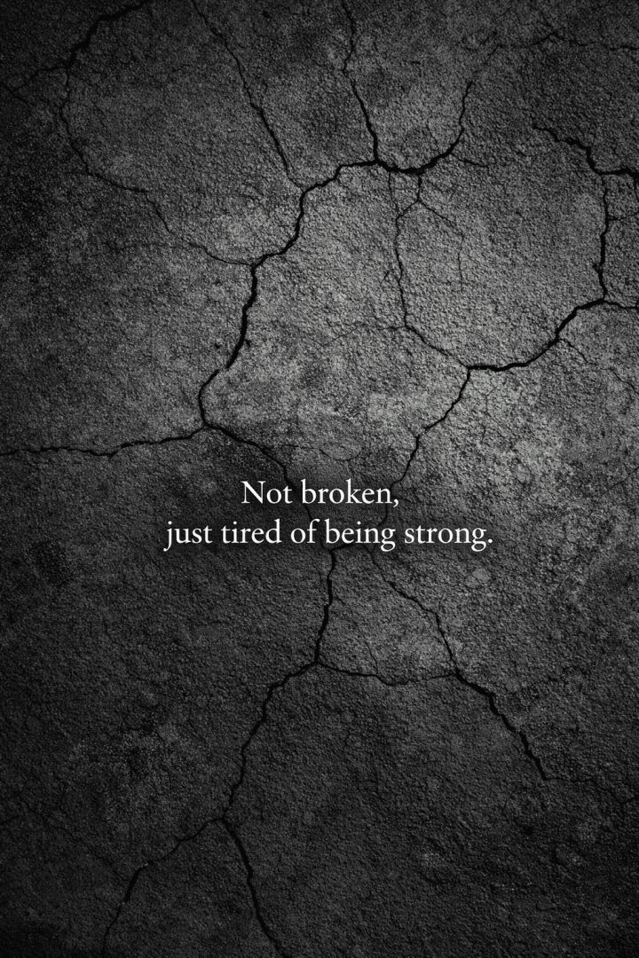 Cracked wall with a powerful quote wallpaper