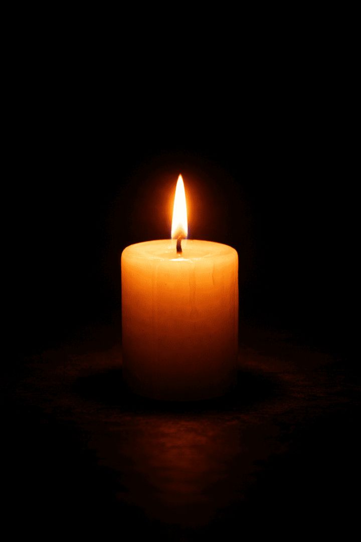 Flickering glow of ivory candle wallpaper