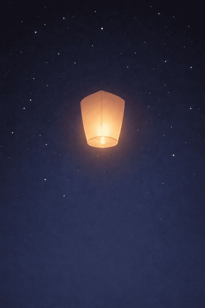 Floating lantern in a starry sky wallpaper