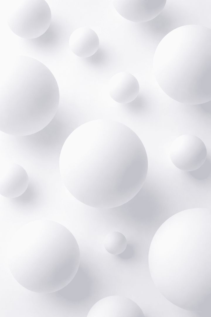 Floating white spheres on white background abstract wallpaper