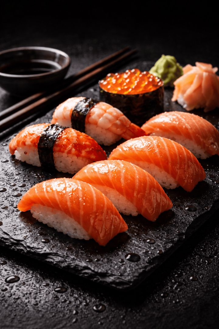 Fresh sushi selection on a slate platter wallpaper
