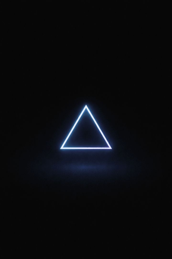 Glowing triangle against deep black wallpaper