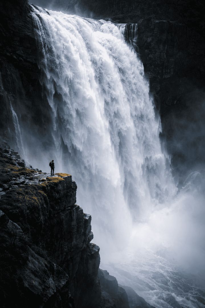 Hiker at the edge of the falls wallpaper