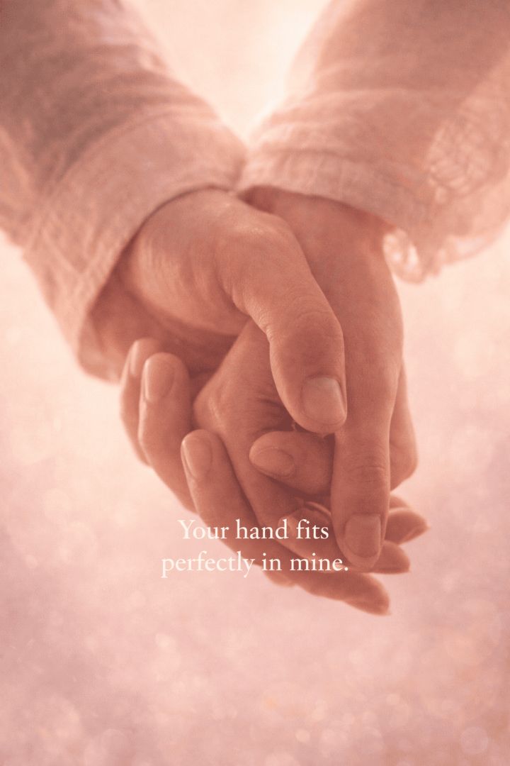 Perfectly intertwined hands in soft light wallpaper