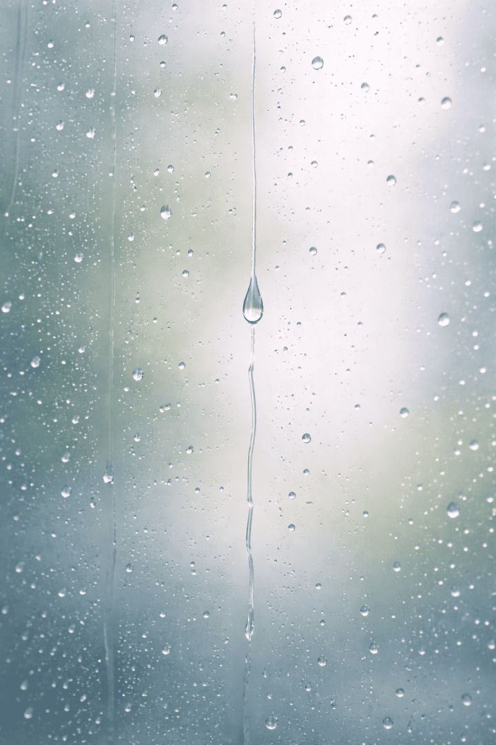 Raindrop on a foggy windowpane minimalist wallpaper