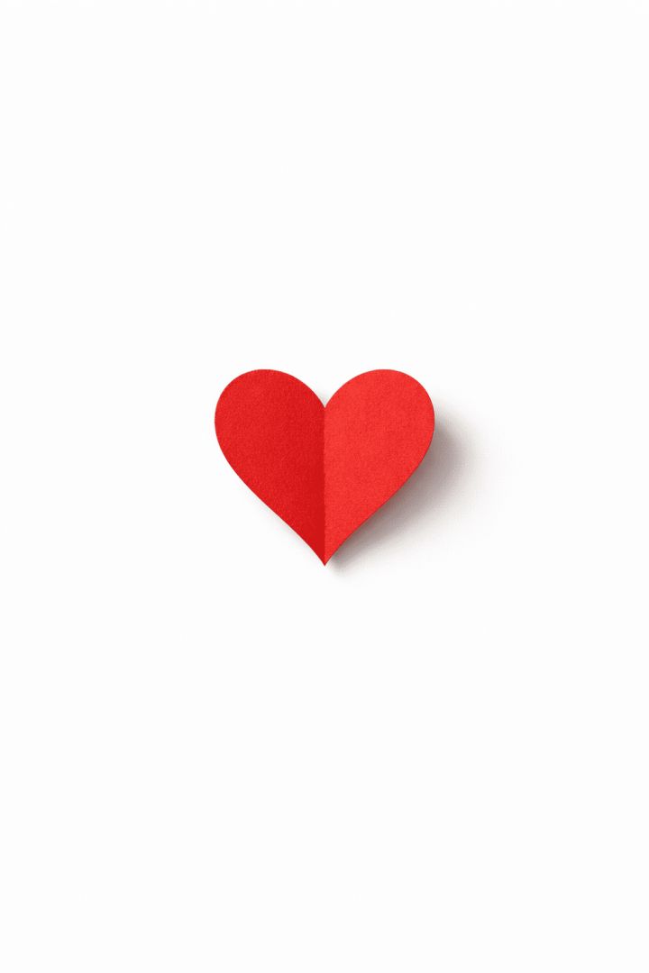 Red paper heart on white backdrop wallpaper